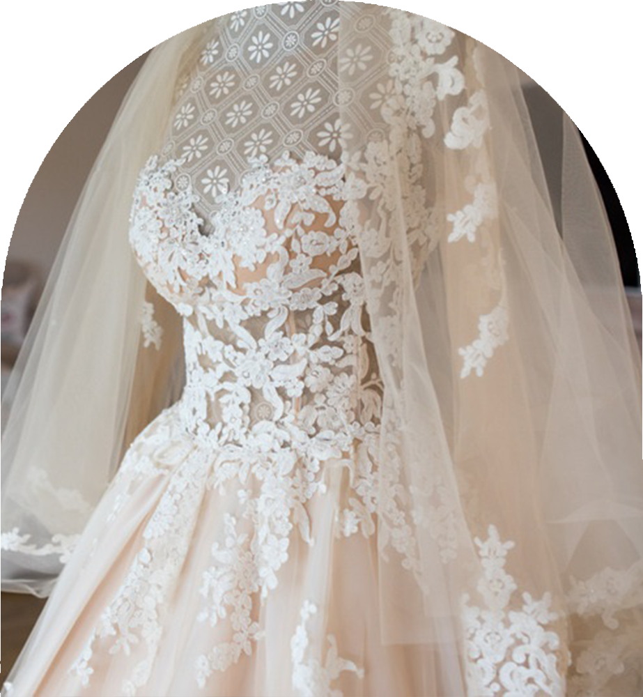 Wedding dress with lace and floral embellishments by John Emily Studio.